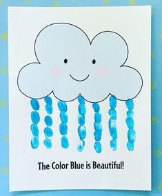 the color blue is beautiful card with clouds and raindrops on it that says, the color blue is beautiful