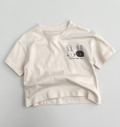 The Little Rabbit Organic Tee is an adorable and eco-friendly t-shirt for kids. Made from high-quality organic cotton, this shirt is soft, comfortable, and gentle on the skin. Perfect for playtime or as a cute everyday outfit, this tee features a charming rabbit design that kids will love. Shop now at Komfy Kloset and give your child a wardrobe staple that's both stylish and sustainable. Specifications: Top: Tee Sleeve Length: Short Season: Summer Pattern Type: Cartoon Print Material: Cotton Gen Rabbit Design, Summer Pattern, Summer Patterns, Cartoon T Shirts, Everyday Outfit, Cute Everyday Outfits, Baby Grows, Clothing Size Chart, Summer Kids