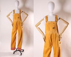 "Late 1960s Early 1970s Golden Yellow Full Length Plaid Cuffed Pants Overalls by Big Smith  These overalls feature: *Golden yellow color *Plaid cuffs on hem of overalls, appear to be an addition not original to the overalls *Pant length *Pockets on front and back  Label: Big Smith Size: Medium Measurements: Bust: Open Waist: 33\" snug  Hip: 41\" snug  Length: 63\" (adjustable with straps) Inseam: 33 1/2\" Rise: 12\" to waist seam  Condition: Great. There are some small dots on the  one pant leg and a worn spot on the inside of one leg. If you have any questions, please ask! Find even more Vintage Medium-Large at: https://www.etsy.com/shop/NaughtyKittyVintage?section_id=17605976&ref=shopsection_leftnav_5 Thanks! -NaughtyKittyVintage" Non Binary Outfits, Yellow Overalls, Pete The Cat Costume, Seussical Costumes, Mustard Yellow Outfit, Wonder Pets, Pants Overalls, Golden Yellow Color, Late 1960s