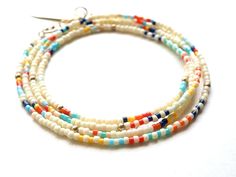 Ivory glass seed beads with stripes and 14k gold filled accents. The pieces can be worn as a wrap bracelet, necklace, or anklet. Measures 27". Peter Pan Collar Blouse, Petal Sleeve, Glass Seed Beads, Peter Pan Collar, Sleeve Detail, Bracelet Necklace, Wrap Bracelet, Anklets, Necklaces Bracelets