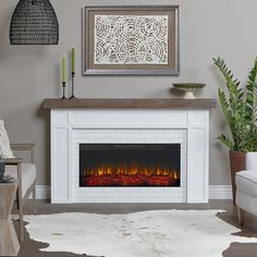 Instantly upgrade your home or office with the addition of the Cravenhall Electric Fireplace. This indoor fireplace features a faux brick surround with clean-cut trim and is topped with a rustic mantel. Part of the Real Flame Landscape Series, this widescreen electric firebox mimics the look of a real fire, but does not require a chimney or vents and conveniently plugs into a standard outlet. Firebox includes infrared LED technology, multiple flame colors and dynamic glowing embers. Available in Faux Foyer, White Electric Fireplace, Modern Electric Fireplace, Glowing Embers, Indoor Electric Fireplace, Recessed Electric Fireplace, Fake Fireplace, Rustic Mantel, Electric Fireplace Insert