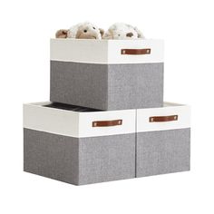 two storage boxes with stuffed animals in them on top of each other, one is grey and the other is white