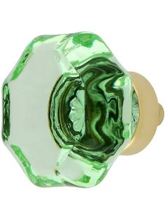 a green glass door knob on a white background