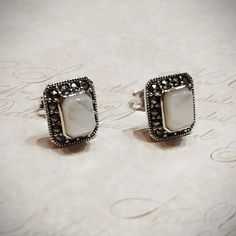 A pair of new mother of pearl square stud earrings in sterling silver decorated with sparkling marcasites.  They Measure 1.3 cm high, 1.1 cm wide. There is Matching pendant available Our shop is in London, Portobello Road. International shipping takes about 5-7 days. White Sterling Silver Rectangular Jewelry, White Rectangular Sterling Silver Jewelry, Classic Silver Rectangular Earrings, Nickel-free White Rectangular Jewelry, Hallmarked Rectangular White Jewelry, Rectangular White Hallmarked Jewelry, Silver Rectangular Stone Sterling Silver Earrings, White Sterling Silver Jewelry With Rectangular Stone, Emerald Green Earrings