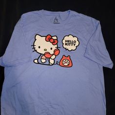 Brand New. Sanrio Hello Kitty,Size Large T Shirt. Super Cute, Perfect As A Gift Also. Blue T-shirt With Character Print For Spring, Light Blue T-shirt With Cartoon Print For Spring, Cute Hello Kitty Cotton T-shirt, Cute Cotton Hello Kitty T-shirt, Fun Hello Kitty Short Sleeve Tops, Hello Kitty Short Sleeve T-shirt For Spring, Playful Hello Kitty Print Cotton T-shirt, Cute Light Blue T-shirt With Cartoon Print, Blue Cartoon Print Shirt For Spring