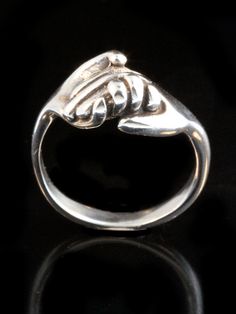 This solid sterling silver clasping Hand Ring is a classic and is beautifully executed. This design is a symbol of love, friendship, support and solidarity. We have many ring sizes immediately available. We will contact you to let you know if we have your chosen ring size in stock or when to expect shipment. All Marty Magic Jewelry is packaged in a beautiful box embossed with the gold foil Marty Magic dragon logo. Perfect for any occasion! Designed in California by Marty Magic. Made in the U.S.A Unique Sterling Silver Jewelry With Tension Setting, Classic Rings With Spring Ring Clasp For Gifts, Magic Jewelry, Dragon Logo, Friendship Ring, Hand Rings, Mother Daughter Gifts, Gifted Hands, Friendship Rings