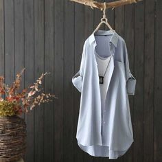 This is perfect for those who are looking for a clothing for a good price. It is fashionable, stylish, and it will look great on anyone who wears it. Do you wanahavit? Spring Button-up Shirt For Layering, Light Blue Shirt With Casual Collar For Spring, Light Blue Long Sleeve Solid Color Shirt, Casual Cotton Blouse With Casual Collar, Solid Shirt For Spring Layering, Blue Button-up Shirt For Layering, Blue Casual Collar Top For Spring, Spring Layering Shirt With Collar, Light Blue Tops With Casual Collar And Button Closure