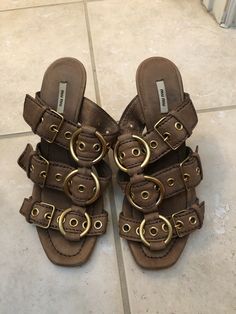 100% Authentic Miu Miu Tan Leather Sandal Pumps 5.5. Retail over $900 Purchased at Neimans Condition is Pre-owned. Shipped with USPS Priority Mail. Please ask all questions prior to purchasing as all sales are final. Comes from a pet free smoke free home Miu Miu Designer Open Toe Sandals, Miu Miu Open Toe Sandals For Summer, Miu Miu Leather Sandals With Open Heel, Miu Miu Leather Sandals For Spring, Vintage Slip-on Sandals With Buckle, Vintage Slip-on Sandals With Buckle Closure, Tan Leather Sandals, Tory Burch Miller Sandal, Tan Leather