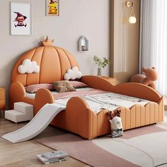 a child's bedroom with an orange bed and slide in the middle, along with other furniture