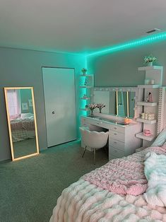 a bedroom with a bed, desk and mirror in it's corner is lit up by green lights