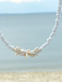 White Star-shaped Ocean-inspired Jewelry, Ocean-inspired White Star Jewelry, Ocean-inspired White Star-shaped Jewelry, Bohemian White Starfish Jewelry, White Star-shaped Jewelry With Starfish Charm, White Starfish Pendant Ocean-inspired Jewelry, White Bohemian Star Jewelry, Bohemian White Star Jewelry, White Beaded Choker For Vacation