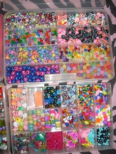 two bins filled with lots of different types of bead and sequins