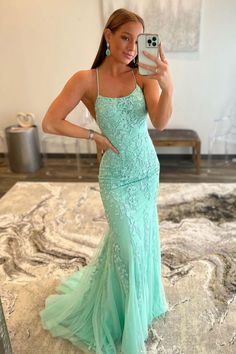 Elevate your special night with Lucille, a breathtaking mermaid-style lace prom dress that redefines elegance. The slender spaghetti-strap scoop neckline offers a balanced blend of sophistication and allure. The dress cascades down to a sweep train, graced by delicate lace appliques that promise a grand entrance. A criss-cross lace-up back not only guarantees a custom fit but also adds an unexpected, sexy twist. Lucille is more than a dress; it's your ticket to a night filled with grace, glamour White Prom Dress Long, Prom Dresses Long Blue, Green Evening Dress, Prom Dresses Long Pink, Backless Evening Dress, Lace Prom Dress, Backless Prom Dresses, Lace Mermaid, Mermaid Evening Dresses