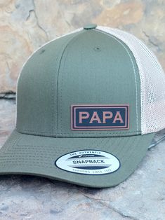 "PAPA PATCH PREMIUM 6 Panel adjustable snapback structured trucker hat. Adjustable snapback OSFM so one size should fit your Papa! The perfect gift for any Dad, Fathers Day or Dad's Birthday! Give the perfect gift to your PAPA! NOTE: Pick your hat color when you place your order. Adjustable snap back so one size fits most! 6 Panel Structured Trucker Hat: Hat Color: Various Fabric: Cotton-Poly/Nylon Mesh Size: Adjustable Snapback One Size Fits Most Washing instructions; Hand wash cold only, wipe Adjustable Trucker Dad Hat With Curved Bill, Adjustable Trucker Baseball Cap With Letter Patch, Adjustable Flat Bill Dad Hat For Father's Day, Curved Bill Trucker Hat With Letter Print As Gift, Adjustable Curved Brim Hat For Father's Day, Customizable Trucker Hat For Father's Day, Trucker Snapback Hat With Letter Patch And Curved Brim, Father's Day Trucker Hat Snapback, Personalized Trucker Hat For Outdoor