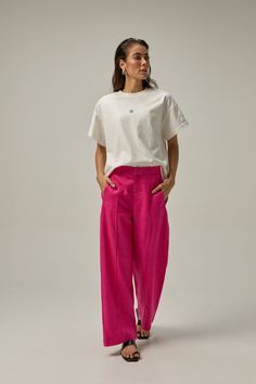 Made of 100% linen fabric, these pants have an elastic waist for added comfort and a straight cut to lengthen the legs. You can wear it high-waisted or on the hips for a more modern look. Our Reverie collection represents the idea of reconnecting with one's creative self and finding inspiration through moments of deep contemplation and imaginative thinking. COMPOSITION AND CARE Material: 100% linen Linen is one of the most sophisticated natural fiber fabrics. It does not hold or block air, nor d Hot Pink Linen Pants Outfit, Pink Flowy Pants Outfit, Modern High-waisted Linen Wide Leg Pants, Modern Linen Wide Leg Pants For Summer, Modern Wide-leg Relaxed Fit Pants, Modern Relaxed Fit Wide-leg Pants, Modern Linen Straight Leg Bottoms, Modern Straight Leg Linen Bottoms, Modern Linen Wide-leg Pants