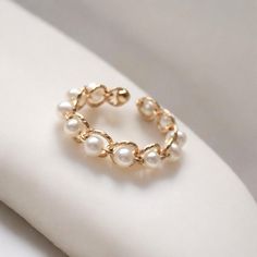 Freshwater Pearl Rings 🌟✨ ✨Elevate your style with our exquisite Freshwater Pearl Rings. Featuring natural freshwater pearls set in 3MM gold filled bands, these rings embody boho minimalism and elegance. Perfect for any occasion, this delicate and versatile piece of jewelry is a must-have addition to any woman's collection. Key Features:  * Natural Freshwater Pearl: Each ring features a beautiful 3MM pearl, adding a touch of natural elegance.  * Gold Filled: Durable and luxurious, ensuring last Elegant Pearl Chain Ring, Elegant Pearl Ring With Pearl Chain, Elegant Round Hypoallergenic Pearl Ring, Elegant Hypoallergenic Round Pearl Ring, Elegant Hypoallergenic Pearl Ring, Elegant White Hypoallergenic Pearl Ring, Pearl White Ring With Pearl Chain, Elegant Pearl Chain Rings For Wedding, Elegant Round Pearl Ring With Pearl Chain