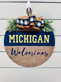 michigan wolverines wooden sign hanging on the wall