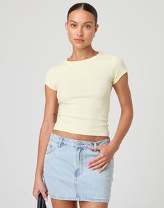 This top is a neccessary basic with a crew neckline and fitted baby tee style. Trendy Spring T-shirt For Layering, Spring Crew Neck Cropped T-shirt For Everyday, Everyday Crew Neck Cropped T-shirt For Spring, Spring Everyday Crew Neck Cropped T-shirt, Spring Everyday Cropped Crew Neck T-shirt, Stretch Cropped T-shirt For Everyday, Trendy Short Sleeve Crew Neck Top For Layering, Basic Crew Neck Cropped T-shirt For Spring, Basic Stretch Short Sleeve Top For Everyday