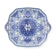 a blue and white plate with an image of the star of david on it