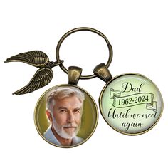 a keychain with a photo of an older man