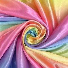 a multicolored fabric is shown as if it was made from silk or satin