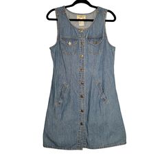 This vintage 90's denim mini dress from Tickets Clothing is a women's size M/8. With a button-up design, sleeveless style, and functional pockets, it's a classic throwback to a stylish era. Made from 100% cotton in a striking blue. * Vintage 90's design * Women's size M/8 * Button-up style * Sleeveless mini dress * Functional pockets * Made from 100% cotton * Blue color * Brand: Tickets Clothing Size: Medium/8 Measurements: Pit to pit 18 in / 46 cm Waist(across, laying flat) 16.5 in / 42 cm Length 36 in / 91 cm Across Hem 22 in / 56 cm Excellent pre-owned condition, wear to the buttons no other flaws  Sold as Pictured. Thanks for viewing! Questions welcome! Vintage Denim Vest With Buttons, Vintage Denim Vest With Buttons For Summer, Vintage Sleeveless Denim Dress With Pockets, Retro Sleeveless Denim Dress, Vintage Sleeveless Denim Dress, Retro Sleeveless Denim Dress For Spring, Sleeveless Vintage Denim Dress With Pockets, Retro Sleeveless Denim Dress For Summer, Summer Retro Sleeveless Denim Dress