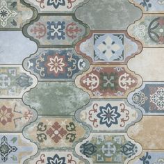 an artistic tile design with many different colors and shapes