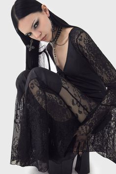 WISTFUL DESIRE JUMPSUIT.- Statement custom lace.- Long flared sleeves.- Lace up front.- Panel details.- Back zip closure. - Fitted.With KILLSTAR branding, Lace: 88% Polyamide 12%Elastane, Main Body: 60% Polyurethane 40%Polyester.Hand wash delicate 30°c / Do not bleach / Do not tumble dry / Do not iron / Do not dry clean. Imported. Grunge Fashion Women, Y2k Black Fashion, Goth Jumpsuit, Goth Mood Board, Witch Clothing Aesthetic, Black And Grey Outfit, Moon Sisters, Moon Outfit, Thigh High Sock