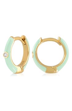 Easy-to-wear hoop earrings will add significant polish to even your most casual ensembles. 1/2" drop; 1/8" width Hinge with snap-post closure Sterling silver with goldtone plate/cubic zirconia Imported Trendy Round Enamel Hoop Earrings, Everyday Enamel Hoop Earrings, Hoop Huggie Earrings In Enamel, Small Hoop Enamel Earrings, Enamel Huggie Hoop Earrings For Pierced Ears, Green Enamel Hoop Earrings, Green Enamel Hoop Jewelry, Trendy Enamel Hoop Jewelry, Enamel Huggie Hoop Earrings