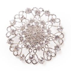 DecoStar At nearly 4" in diameter, our JUMBO round ornate diamond-studded brooch in silver is designed to amaze. If you're looking for a real 'wow factor' this brooch is exactly what your event needs. Tip: If you are a professional decorator and plan to use these often, we suggest using a corsage pin (you can get them from floral supply companies) to attach. This makes attaching much faster and is easier on the fabric you're pinning them to. DecoStar Professional Decor Products - Learn More at w Round Wedding Brooches With Diamond Accents, Wedding Brooches With Diamond Accents, Elegant Round Brooches With Rhinestones, Elegant Round Rhinestone Brooches, Round Brooches With Diamond Accents For Gift, Round Diamond Accented Brooches For Gift, Round Brooches With Diamond Accents As A Gift, Elegant Silver Crystal Pins, Silver Wedding Brooch With Diamond Accents