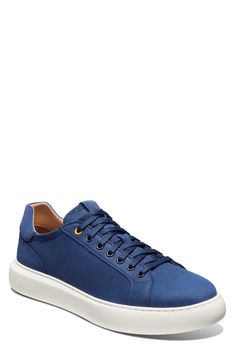 A rich leather upper lends street-savvy appeal to a low-profile sneaker designed with optimal cushioning and a sturdy cupsole for lasting wear. Water-resistant Cushioning: absorbs impact and distributes weight for consistent, buoyant comfort under each step Removable, cushioned insole Leather upper/textile lining/synthetic sole Made in Portugal Navy Low-top Sneakers With Perforated Toe Box, Blue Leather Custom Sneakers For Light Sports, Classic Blue Sneakers With Perforated Toe Box, Blue Low-top Sneakers With Removable Insole, Navy Low-top Custom Sneakers With Cushioned Footbed, Navy Low-top Custom Sneakers With Cushioned Midsole, Custom Navy Low-top Sneakers With Abzorb Midsole, Blue Sneakers With Contrast Sole, Navy Suede Round Toe Sneakers