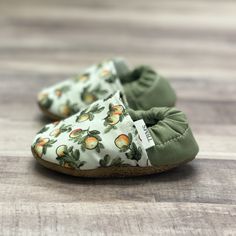 "*New!* Add a personalized tag to your moccasins (see personalization instructions)! These adorable moccasins are perfect for your little one! Trendy and comfortable, our moccasins are guaranteed to stay on your baby or toddler's feet. These are one-of-a-kind, handmade moccasins that can be paired with any outfit. Each pair is made with durable cloth and layers of felt and lined with luscious fleece for extra comfort while a heel guard reinforces the quality. These moccasins have a soft leather- Spring Gift Booties With Soft Sole, Green Moccasins With Rubber Sole For Spring, Spring Green Moccasins With Rubber Sole, Casual Green Slippers With Soft Sole, Casual Moccasins With Round Toe For Playtime, Casual Round Toe Moccasins For Playtime, Casual Booties With Soft Sole As Gift, Casual Spring Booties For Playtime, Casual Round Toe Moccasins