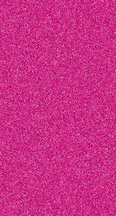 a bright pink background with small speckles