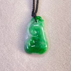 Green Natural Ruyi Jade, Genuine Jadeite Pendant, Hancrafted Ruyi Jadeite, Handmade Jade Jewelry Materials: Genuine Type A jadeite with adjustable string Dimension:  Height: 29.6 mm Width: 18.8 mm Thickness: 4.7 mm The jadeite pendant are made from natural real Burmese jadeite stone. They are handmade items. This is the perfect gift for mom, wife, fiancée, girlfriend, valentine, daughter, family or friend. It is a special gift for mother's day, valentine's day, wedding, anniversary, birthday, Ch Green Jade Amulet Necklace, Handmade Jade Emerald Necklace For Gift, Traditional Green Jade Necklaces, Green Carved Amulet Necklace, Handmade Green Emerald Necklace With Round Pendant, Handmade Round Green Emerald Necklace, Jewelry Materials, Jade Jewelry, Jade Pendant