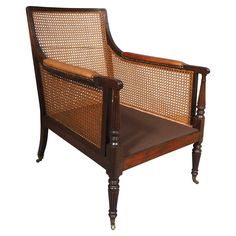 an antique chair with caned back and armrests