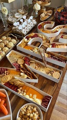 a table filled with lots of different types of snacks and desserts on top of it