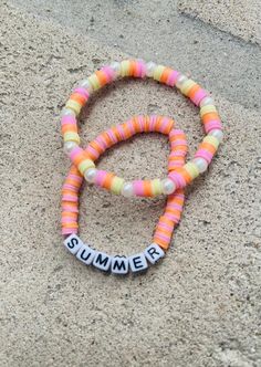 It's a summer theme bracelet made from pastel colors. Cute and fun! Multicolor Beach Bracelets For Summer, Multicolor Bracelets For Beach In Summer, Multicolor Bracelets For Summer Beach, Multicolor Summer Friendship Bracelets For Vacation, Multicolor Friendship Bracelets For Summer Vacation, Summer Vacation Multicolor Friendship Bracelets, Summer Bohemian Friendship Bracelets With Letter Beads, Multicolor Summer Jewelry, Bohemian Summer Friendship Bracelets With Letter Beads