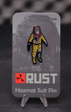 a pin with an image of a man in space suit on it's back