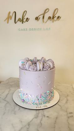 the cake is decorated with pastel colors and sprinkles