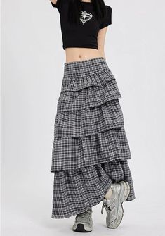 Channel understated chic with this Layered Plaid Maxi Skirt featuring delicate ruffle details.
Crafted from a comfortable blend of mainly cotton, this skirt showcases a multi-layered design that adds a playful twist to the classic plaid pattern. The high-waist cut ensures a flattering silhouette, while the versatile style makes it easy to dress up or down. It's a piece that carries a perfect balance of edgy and professional aesthetics.
Pair this skirt with a tucked-in graphic tee and sneakers fo Chic Tiered Maxi Skirt With Layered Hem, Casual Flared Skirt Bottoms With Layered Hem, Chic Relaxed Tiered Skirt, Relaxed Skirt With Layered Hem, Chic Tiered Layered Skirt, Layered Voluminous Tiered Skirt, Casual Flared Skirt With Layered Hem, Casual Layered Hem Skirt, Relaxed Long Skirt With Layered Hem