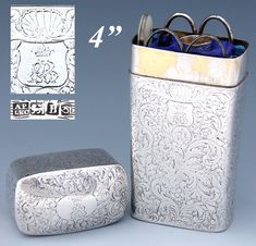 a silver box with glasses in it next to a metal container and another item that has been cut out