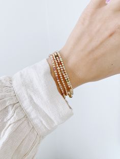 We have teamed up with Simple Joys Shop to bring you a collaboration of premium beaded gold filled wrist wear. These bracelets are created custom to your wrist size. ∙ D E T A I L S ∙ - 3mm bead size- Your choice of beaded gemstone- 18k Gold Filled Beads- Made with strong stretch cord to your custom size! Whats your size? It's super simple to measure. Grab a piece of yarn or flexible fabric and wrap it around your wrist (keep it neutral, not too tight and not too loose). Make a mark on the fabric & measure against a ruler! Always round up if you're between sizes :) ∙ G O L D ∙ F I L L E D ∙ Gold-filled components contain 100+ times more real gold than gold-plated components and are both durable and tarnish resistant. It is more affordable and accessible than solid gold but higher quality t Beaded 14k Gold Filled Yellow Gold Bracelets, Minimalist Hand-strung Beaded Bracelets In 14k Gold Filled, Everyday Bracelets With 14k Gold Beads, Hand-strung Minimalist 14k Gold-filled Bracelet, Minimalist Hand-strung 14k Gold Filled Beaded Bracelets, Everyday 14k Gold Filled Beaded Bracelets With Tiny Beads, Adjustable Stackable Yellow Gold Beaded Bracelets, Gold Minimalist Hand-strung Beaded Bracelets, Stackable Adjustable Yellow Gold Beaded Bracelets