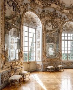 an ornate room with mirrors and benches in it