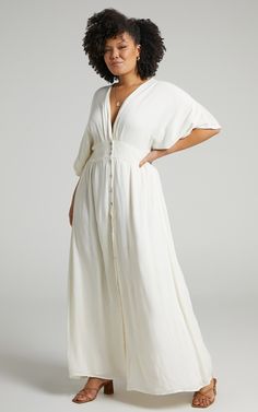 Sitting Pretty Maxi Dress In Natural | Showpo V-neck Maxi Dress With Button Closure For Daywear, Flowy V-neck Maxi Dress With Buttons, V-neck Maxi Dress With Buttons For Date Night, V-neck Maxi Dress With Buttons For Daywear, Flowy Spring Maxi Dress With Button Closure, Chic Flowy Button-up Maxi Dress, Casual Flowy Maxi Dress With Button Closure, Daywear Maxi Dress With Buttons, Buttoned Maxi Dress For Daywear