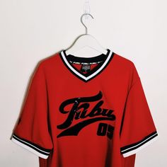 Vintage y2k red Fubu jersey. FUBU 05 Jersey. FUBU 05 graphic logo on chest. FUBU ATHLETICS 1992  Fubu jersey Fubu top Fubu shirt Fubu t shirt P2P 24 INCH, LENGTH 31 INCH Size large / Good condition UK AND WORLDWIDE SHIPPING SERVICE  FULLY TRACKABLE SHIPPING SERVICE Red Varsity Jersey For Streetwear, Red Baseball Jersey For Streetwear With Team Spirit, Red College Jersey With Letter Print, Red Cotton Jersey With Team Name, Red Team Spirit Baseball Jersey For Streetwear, College Red Jersey With Letter Print, Red Baseball Jersey With Team Spirit For Streetwear, Red College Baseball Jersey With Team Logo, College Baseball Jersey With Team Logo In Red