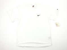 Brand: Nike Size: Medium Color: White Condition: Pre-Owned Condition ** Please keep in mind anything over 10 years old is most likely going to have some staining, fading, cracking and small snags or holes.** Please see all pictures!!! 90s Style White Short Sleeve T-shirt, 90s Style Short Sleeve Sports T-shirt, Classic White Sports T-shirt, White Short Sleeve T-shirt With 90s Style, Classic Short Sleeve Sports T-shirt, White Short Sleeve T-shirt 90s Style, 90s White T-shirt With Logo Print, Nike Retro Short Sleeve Top, Retro Nike Sports Tops