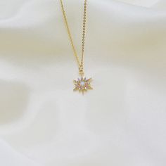 "14k gold plated opal star pendant on a 16k gold plated over brass cable chain. 17\" chain with a 3\" extender. Lobster clasp. Care tips:   -use soft microfiber cloth to polish jewelry  -don't sleep or shower in jewelry  -avoid the use of perfumes, lotions, and other chemicals on your jewelry  -store in a soft pouch or separate from other jewelry  <3" Gold Plated Star Charm Necklaces, Gold Starburst Necklace For Gift, Gold Starburst Necklace With Star Charm, Dainty Gold Starburst Necklace, Gold Star Necklace Perfect As A Gift, Don't Sleep, Star Pendant Necklace, Flower Pendant Necklace, Opal Necklace