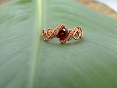 Copper wire ring with red cubic zirconia! This specific ring is in US size 5. You don't know your ring size? No problem! Click on the link to convert your size ring to other country standards. http://www.ringsizes.co or you can ask me and i will make the conversion for you! You may also like https://www.etsy.com/listing/496271524 Rings may vary a little due to their handmade nature. You will receive your ring in a lovely ivory magnetic box to secure your jewel's safety. If you have any question Elf Ring, Elven Ring, Copper Wire Ring, Ring Crystal, Wire Wrapped Ring, Wire Ring, Diy Wire Jewelry, Copper Ring, Wire Rings