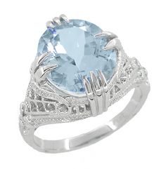 Aquamarine Oval Art Deco Filigree Ring in 14 Karat White Gold $1,245.00 http://www.antiquejewelrymall.com/r157a.html Art Deco Filigree, Claw Prong, Right Hand Rings, Sterling Silver Filigree, Antique Inspiration, Aquamarine Rings, Filigree Ring, February Birth Stone, Blue Topaz Ring