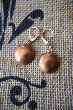 These light weight hand hammered penny earrings are sure to be a conversation starter.  Pennies patina with age and will only increase in beauty. Hammered Bronze Vintage Earrings, Vintage Hammered Bronze Earrings, Vintage Bronze Hammered Earrings, Vintage Hammered Copper Earrings, Copper Pennies, Penny Bracelet, Metal Jewelry Making, Hand Stamped Metal, Metal Stamped Jewelry